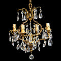 Chic lustre à pampilles en cristal 4 feux bronze doré H 69 cm vintage