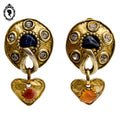 Grosses boucles d’oreilles clips dorées signées Claire Dévé bijou vintage