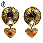 Grosses boucles d’oreilles clips dorées signées Claire Dévé bijou vintage