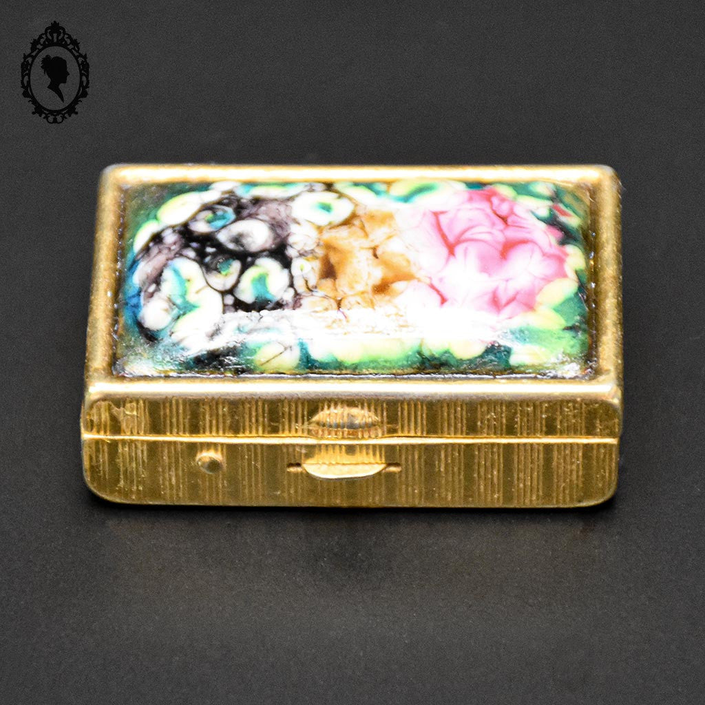 Jolie boite à pilules émaux polychromes et doré vintage