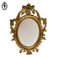 Petit miroir glace cadre ovale mural doré fronton arabesque baroque H 29 cm vintage