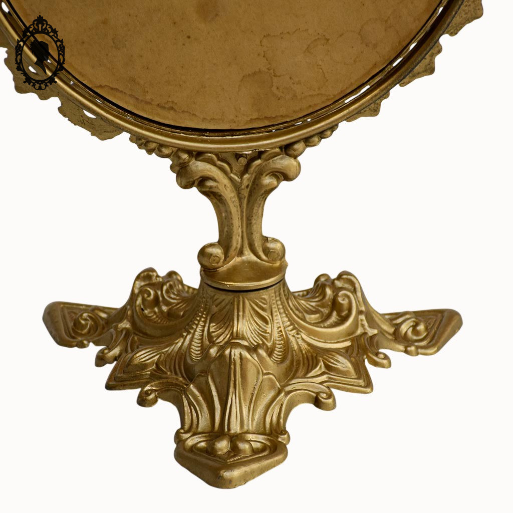 Psyché miroir doré ovale pivotant à poser sur pied H 50 cm rocaille arabesque