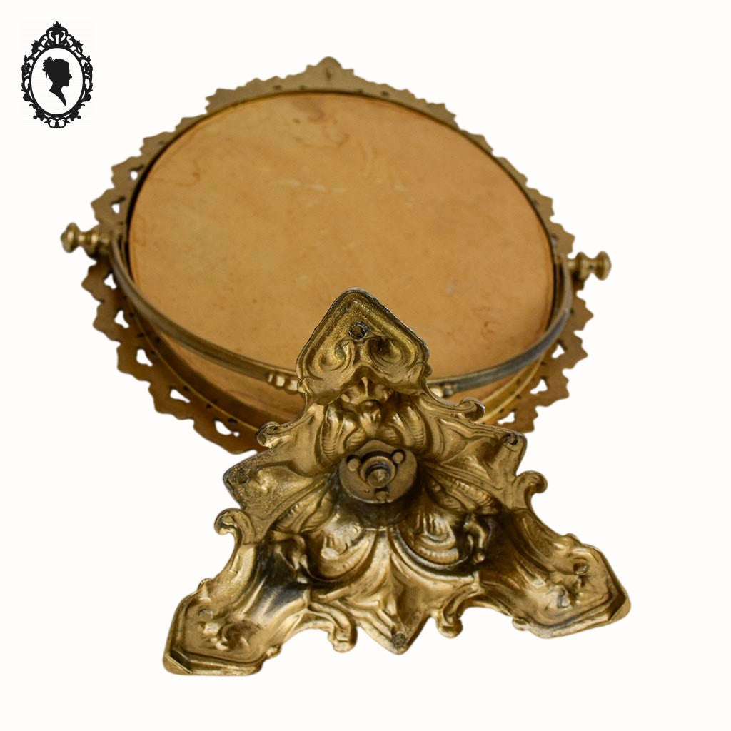 Psyché miroir doré ovale pivotant à poser sur pied H 50 cm rocaille arabesque