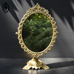 Psyché miroir doré ovale pivotant à poser sur pied H 50 cm rocaille arabesque