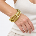 Bracelet vintage à 7 joncs entrelacés en laiton doré