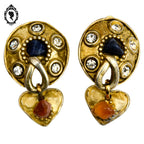 Grosses boucles d’oreilles clips dorées signées Claire Dévé bijou vintage