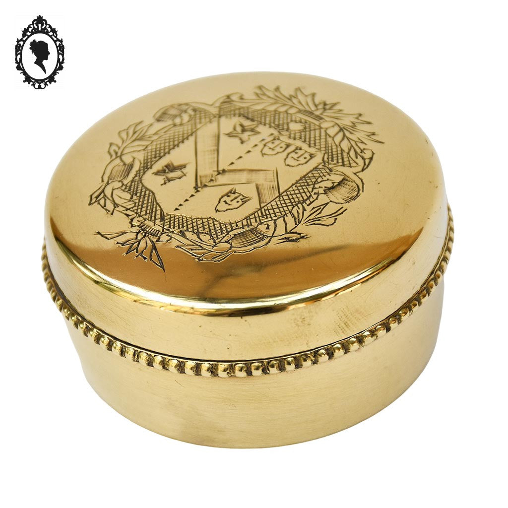 Jolie boite bonbonnière ronde dorée en laiton avec armoiries blason