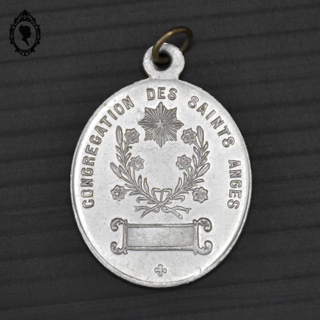 Médaille religieuse grise ovale en fer blanc St Ange Gardien Soyez mon guide vintage