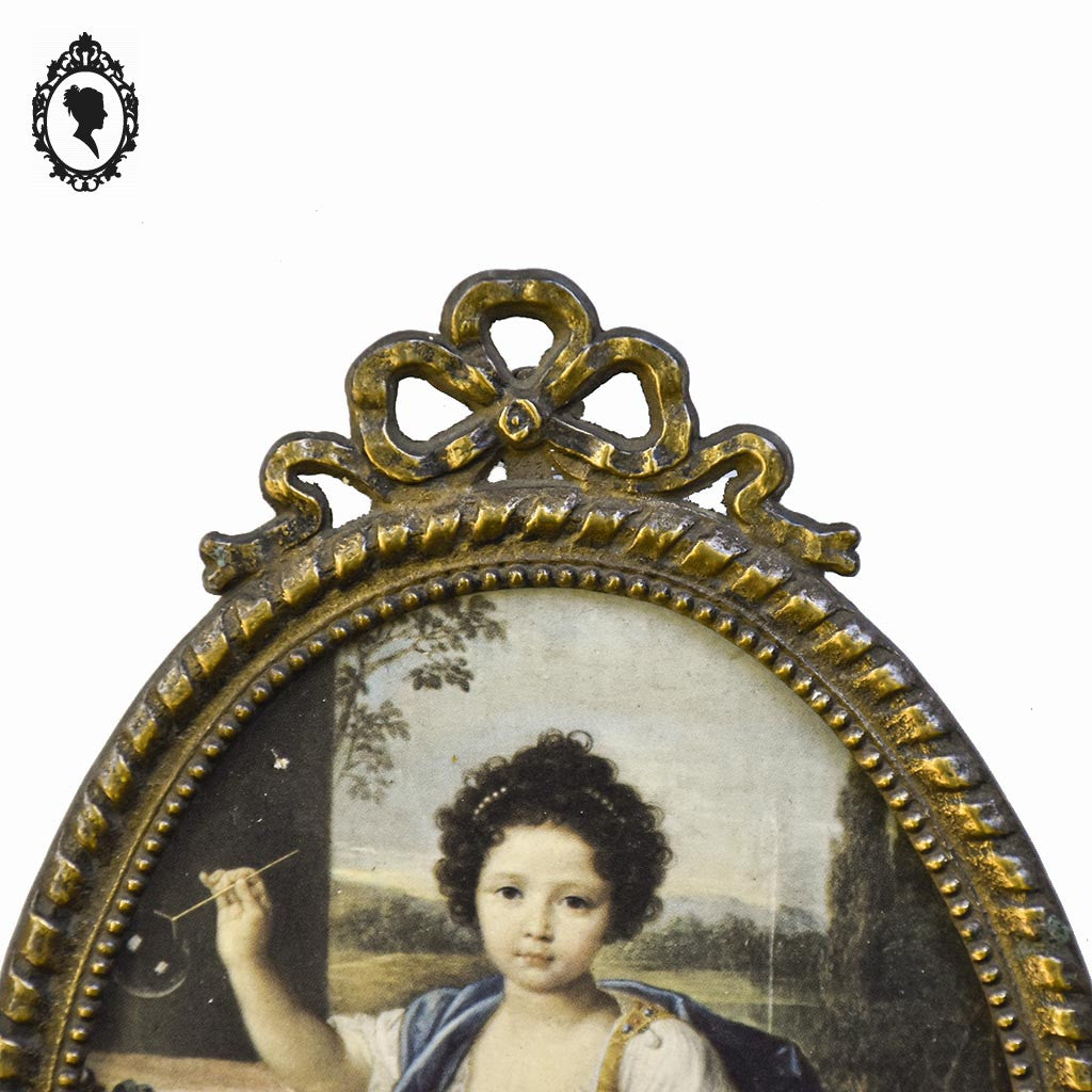 Petit cadre ovale nœud style Louis XV métal doré mural vintage