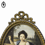 Petit cadre ovale nœud style Louis XV métal doré mural vintage