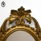 Petit miroir glace cadre ovale mural doré fronton arabesque baroque H 29 cm vintage