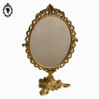 Psyché miroir doré ovale pivotant à poser sur pied H 50 cm rocaille arabesque