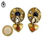 Grosses boucles d’oreilles clips dorées signées Claire Dévé bijou vintage