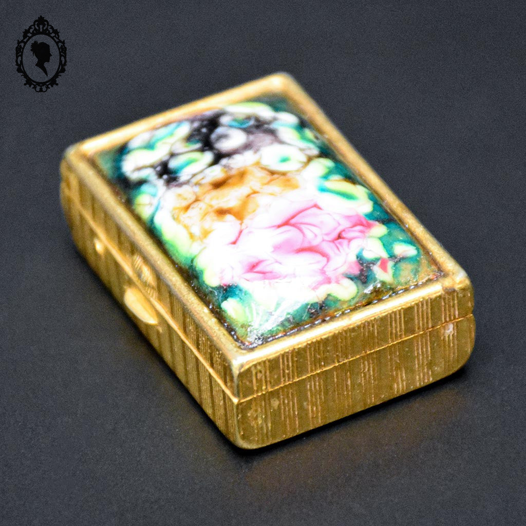 Jolie boite à pilules émaux polychromes et doré vintage