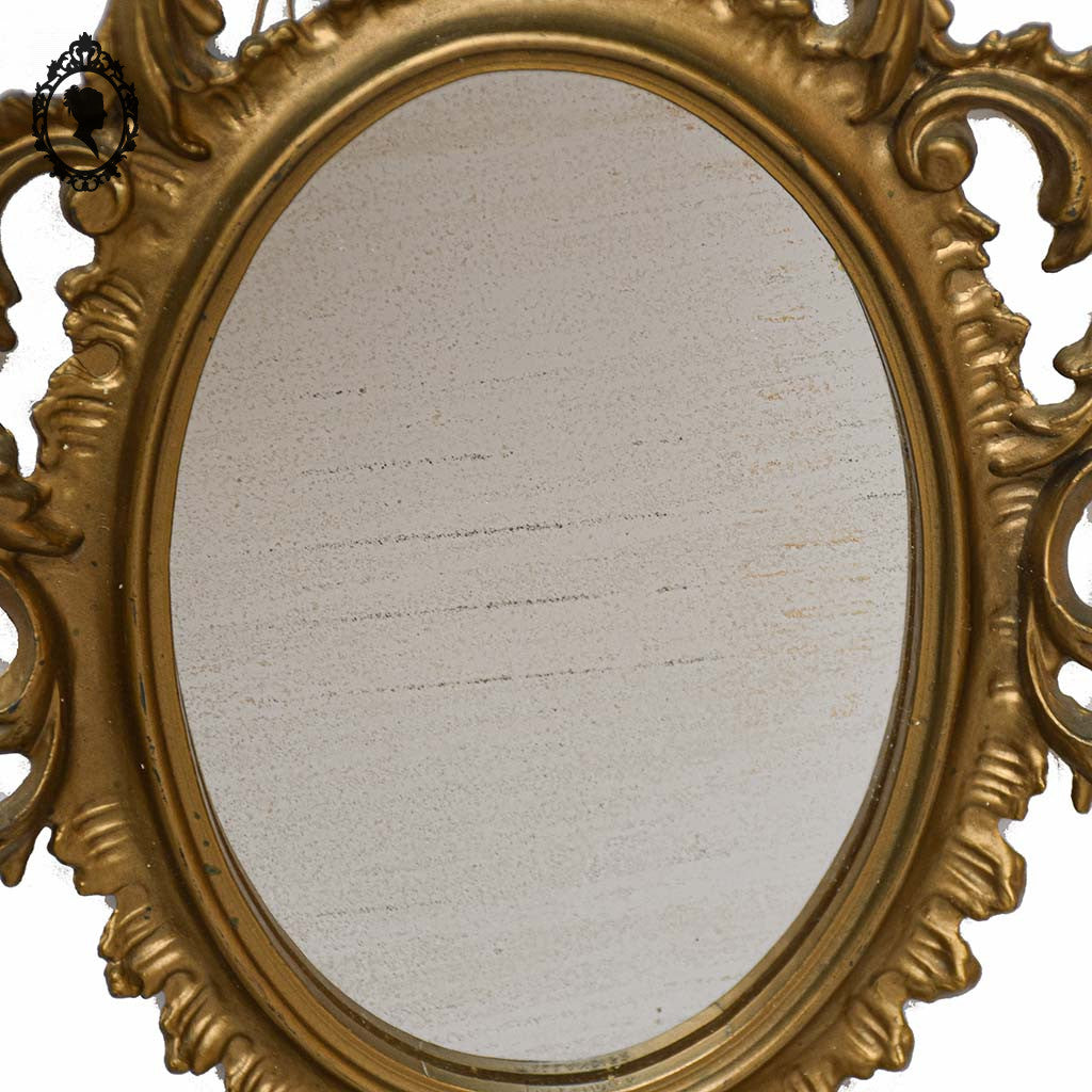 Petit miroir glace cadre ovale mural doré fronton arabesque baroque H 29 cm vintage