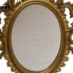 Petit miroir glace cadre ovale mural doré fronton arabesque baroque H 29 cm vintage