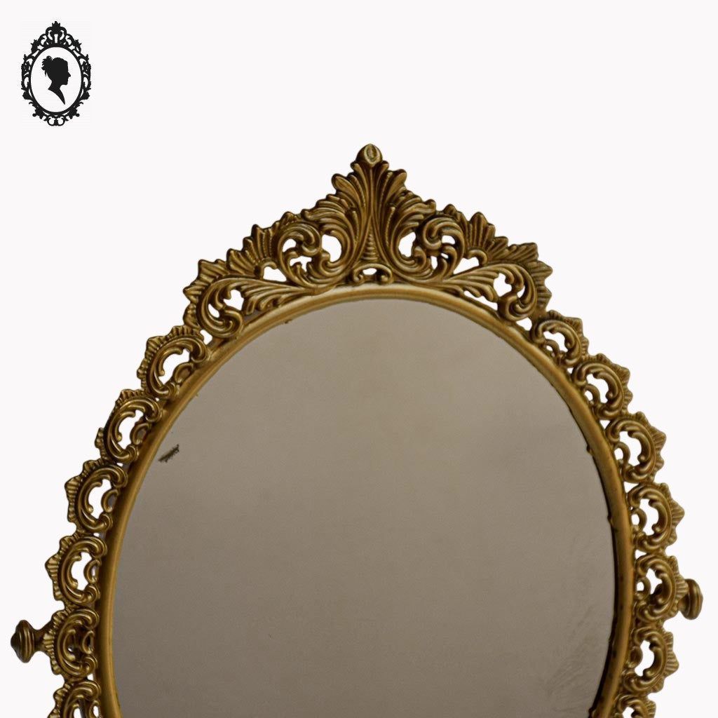 Psyché miroir doré ovale pivotant à poser sur pied H 50 cm rocaille arabesque