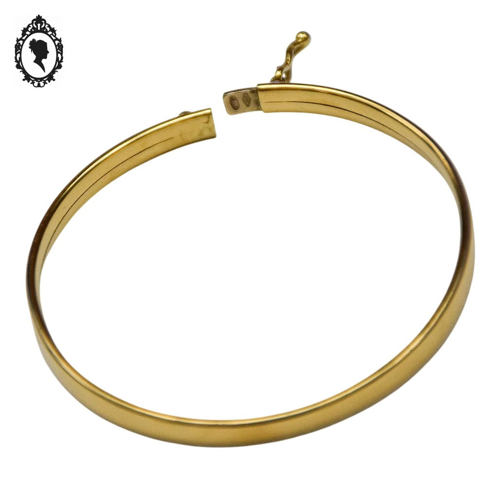 Bracelet bébé enfant jonc ovale ouvrant en or jaune avec poinçons