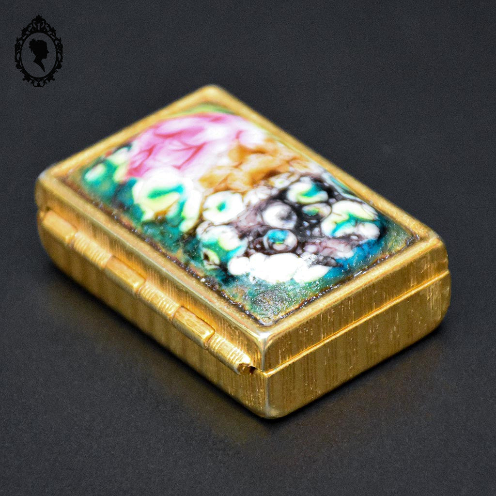 Jolie boite à pilules émaux polychromes et doré vintage