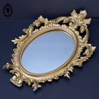 Petit miroir glace cadre ovale mural doré fronton arabesque baroque H 29 cm vintage