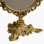 Psyché miroir doré ovale pivotant à poser sur pied H 50 cm rocaille arabesque