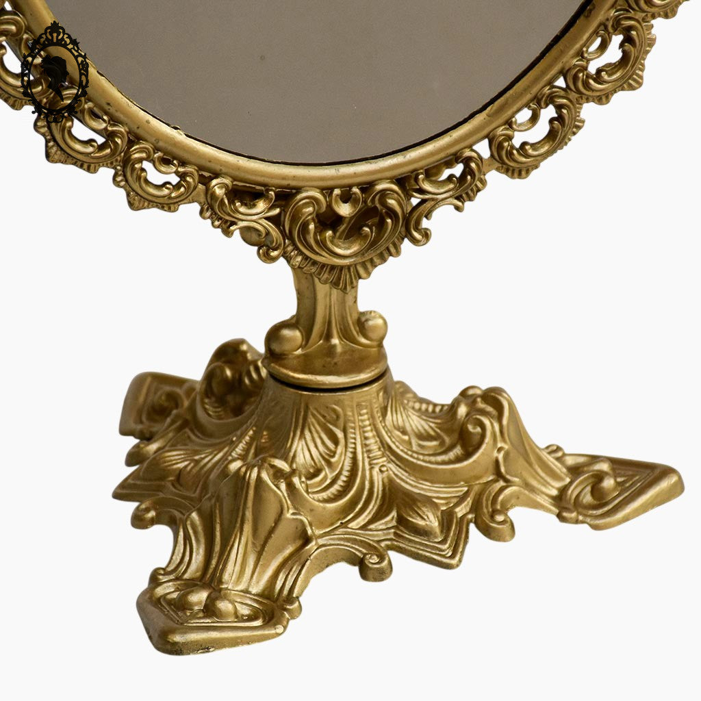 Psyché miroir doré ovale pivotant à poser sur pied H 50 cm rocaille arabesque