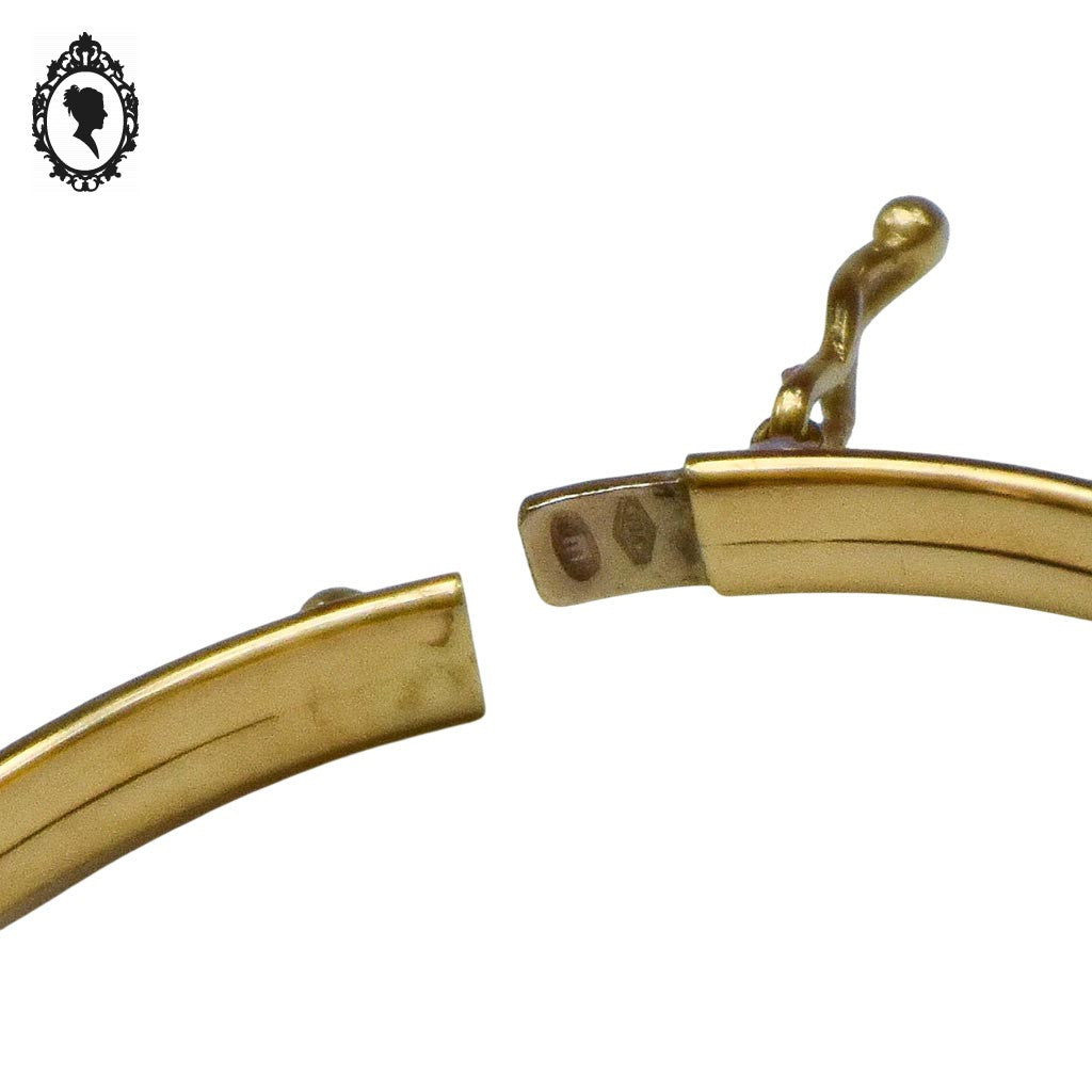 Bracelet bébé enfant jonc ovale ouvrant en or jaune avec poinçons