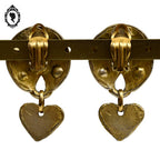 Grosses boucles d’oreilles clips dorées signées Claire Dévé bijou vintage