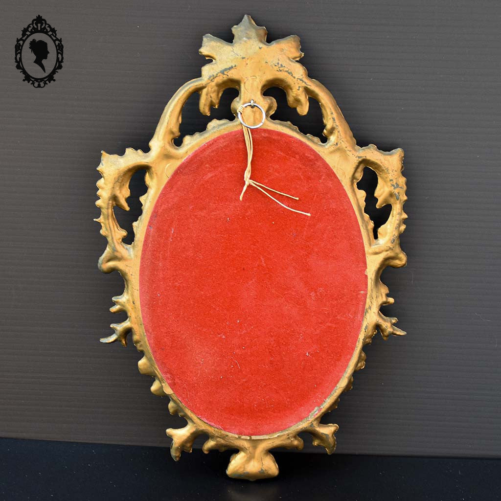 Petit miroir glace cadre ovale mural doré fronton arabesque baroque H 29 cm vintage