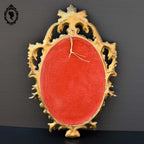 Petit miroir glace cadre ovale mural doré fronton arabesque baroque H 29 cm vintage