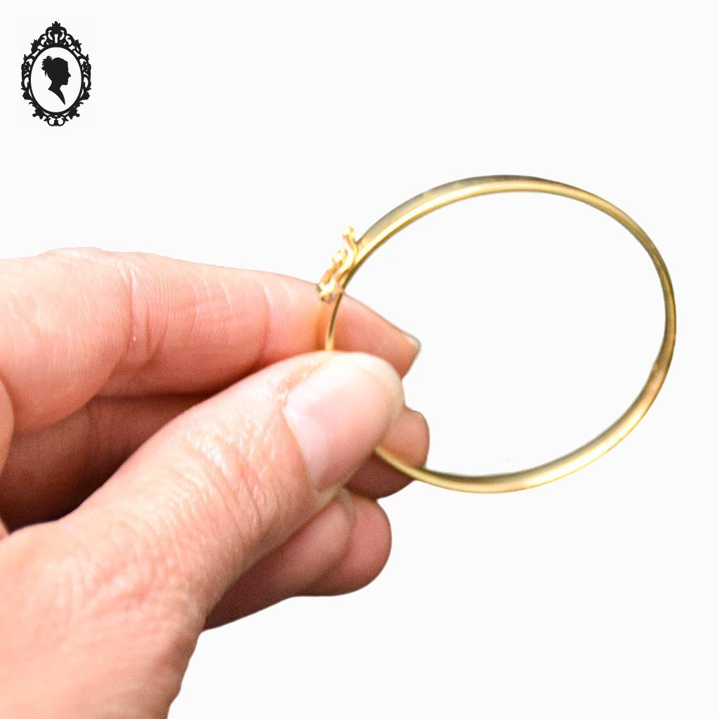Bracelet bébé enfant jonc ovale ouvrant en or jaune avec poinçons