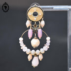 Chic paire de boucles d’oreilles pendantes perle rose beige
