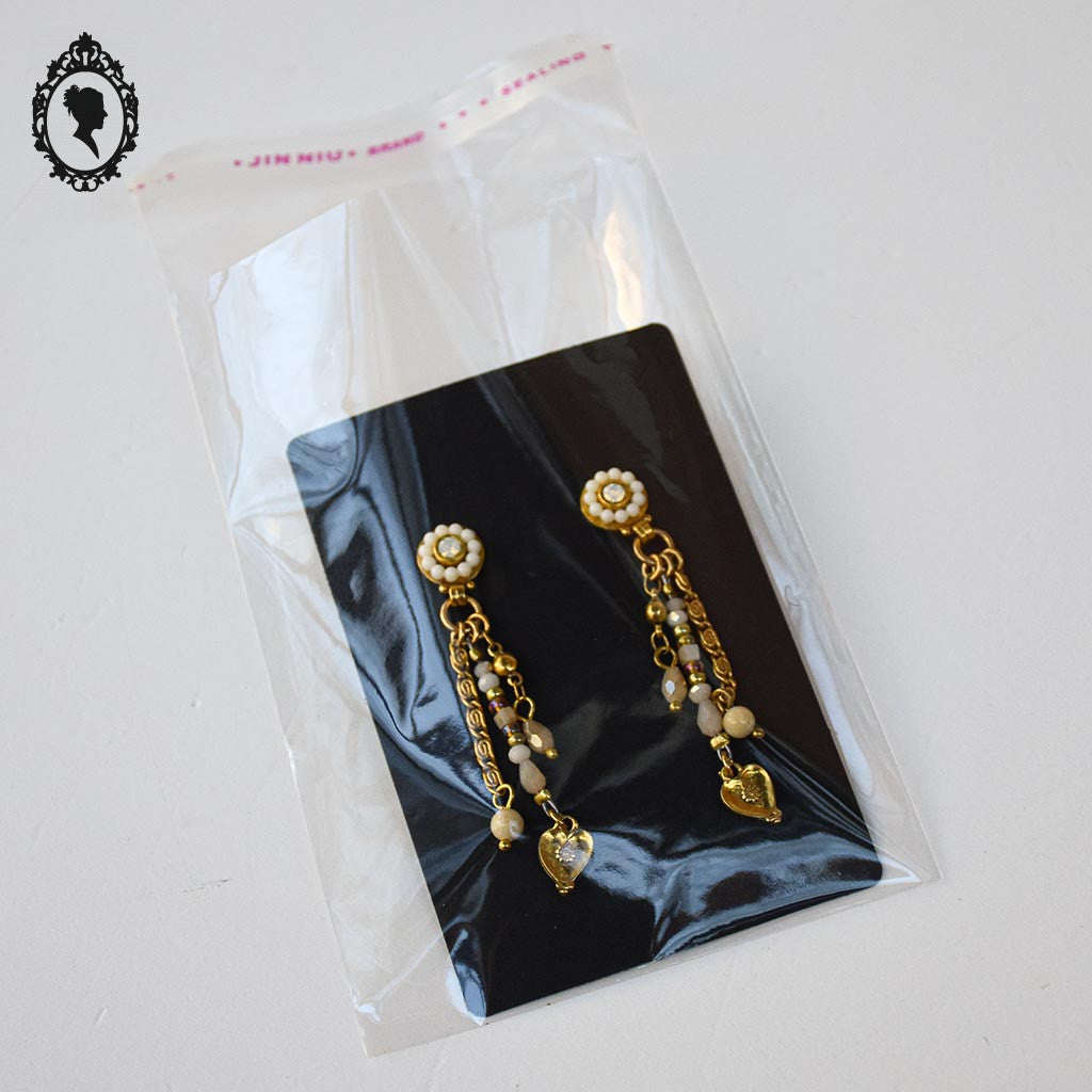 Chic paire de boucles d’oreilles percées pendantes beige doré bijoux Statu Quo