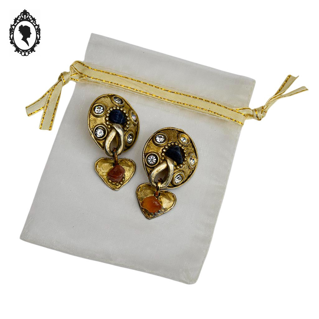 Grosses boucles d’oreilles clips dorées signées Claire Dévé bijou vintage