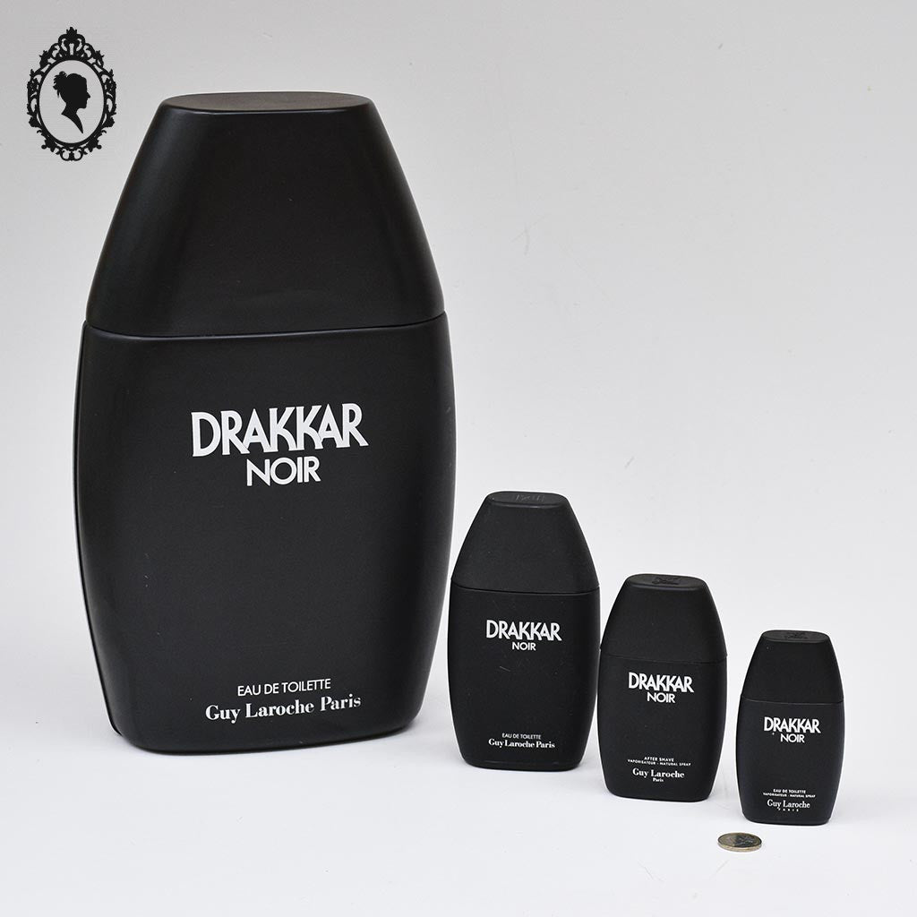 Lot 4 flacons factice géant à petit vides en cascade Parfum Drakkar noir de Guy Laroche objet de collection de Vitrine parfumerie