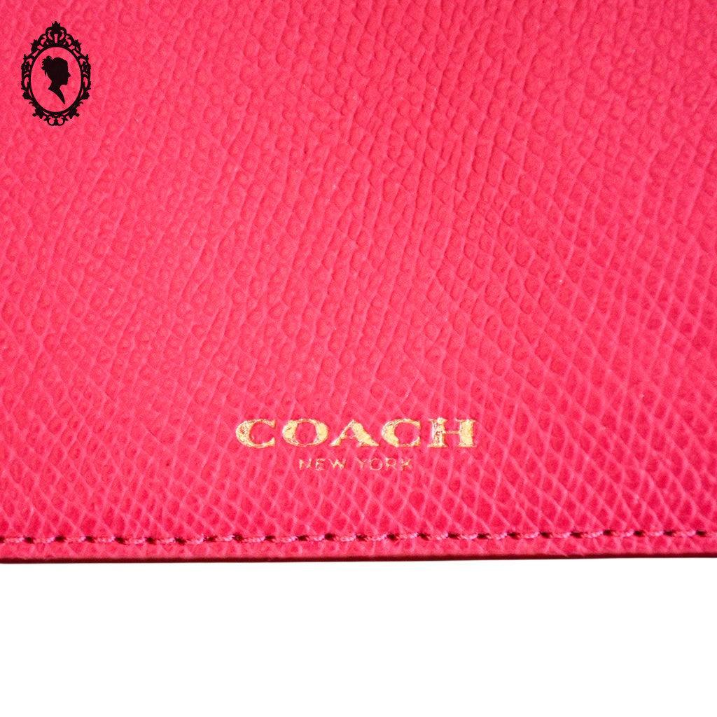 Pochette Coach rose fuchsia cuir grainé 20,8 x 11,5 cm femme New York