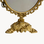 Psyché miroir doré ovale pivotant à poser sur pied H 50 cm rocaille arabesque