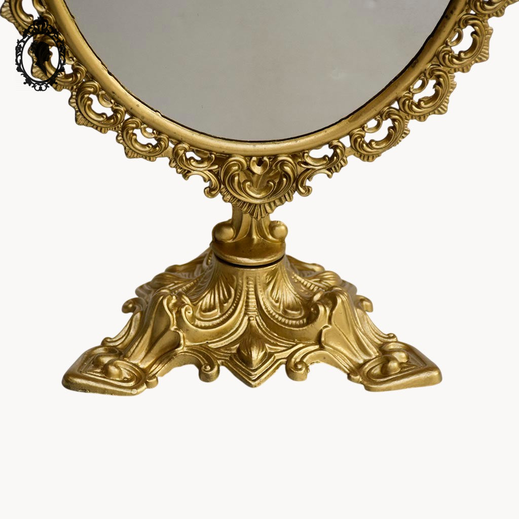 Psyché miroir doré ovale pivotant à poser sur pied H 50 cm rocaille arabesque