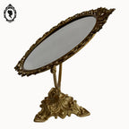 Psyché miroir doré ovale pivotant à poser sur pied H 50 cm rocaille arabesque