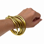 Bracelet vintage à 7 joncs entrelacés en laiton doré